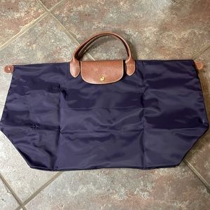 Longchamp Le Pliage nylon weekender bag.